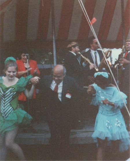 Mario Bauza, dancing. The singer and the reed section are in the background.